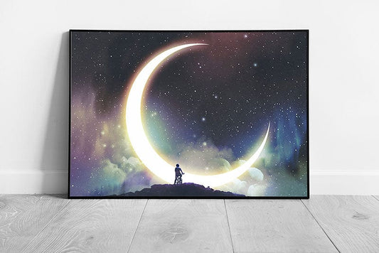 Young Boy Riding Bicycle Looking At The Stunning Crescent Moon In The Beautiful Sky Wall Art Print on Paper Framed Picture print